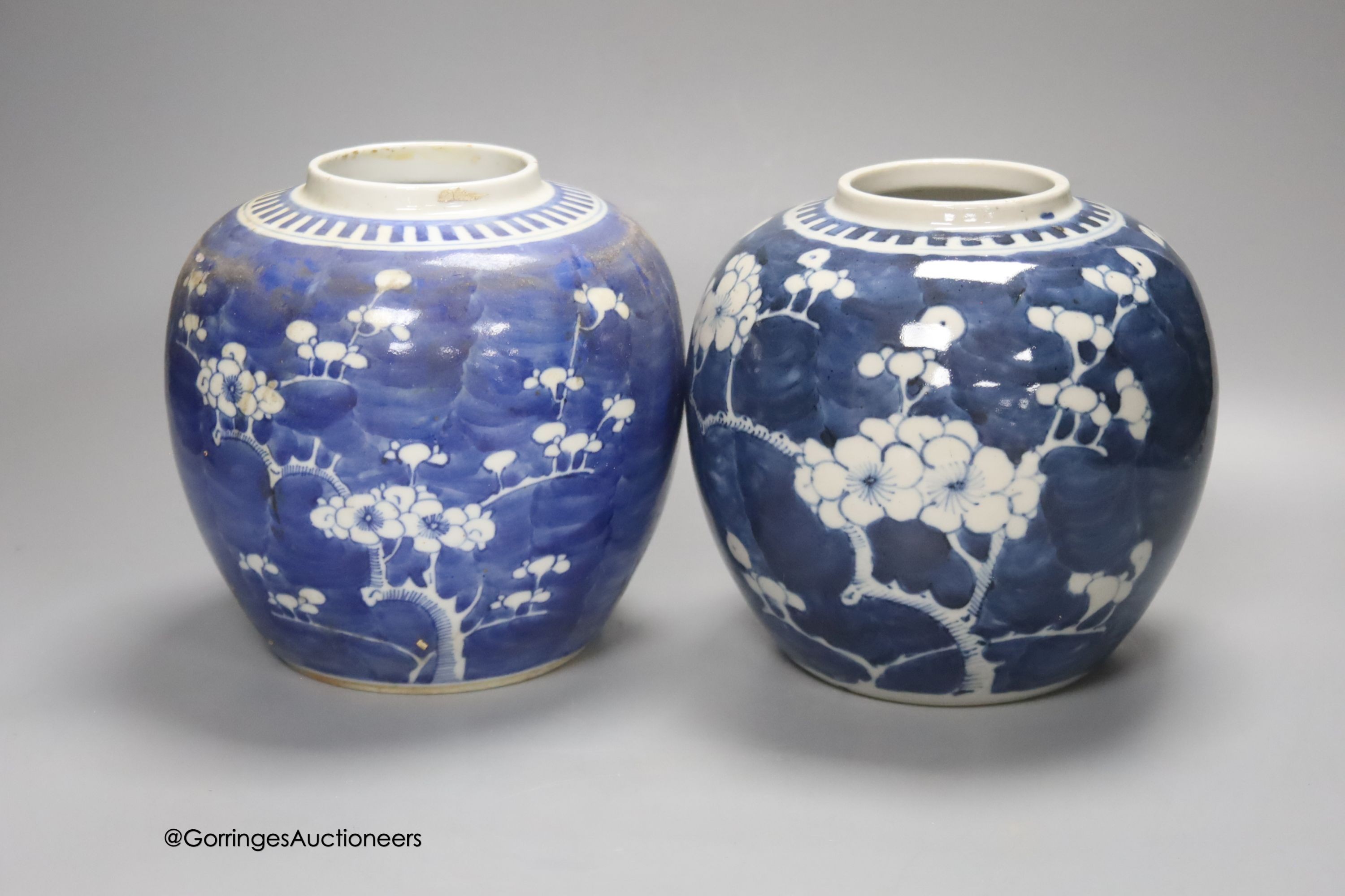 Two early 20th century Chinese blue and white prunus jars, tallest 16cm